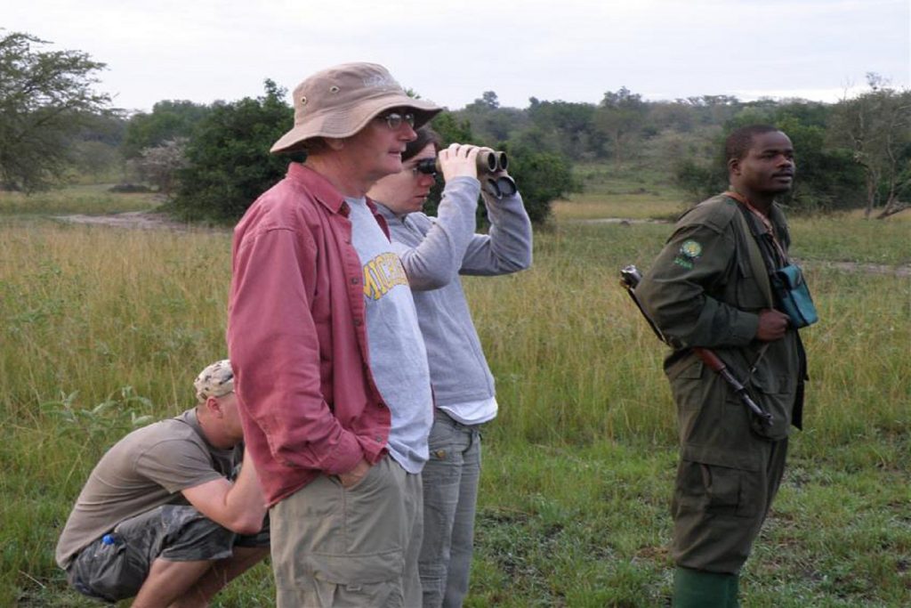 Guests on a hiking safari in Queen Elizabeth National Park