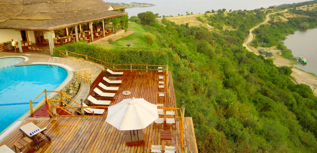 View of Kazinga boat cruise docking jetty from Mweya Safari Lodge, Queen Elizabeth National Park